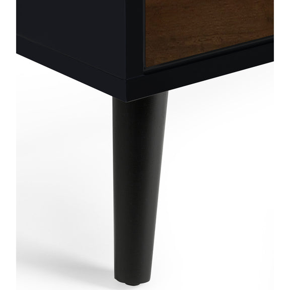 Close-up of a black furniture leg on a white background