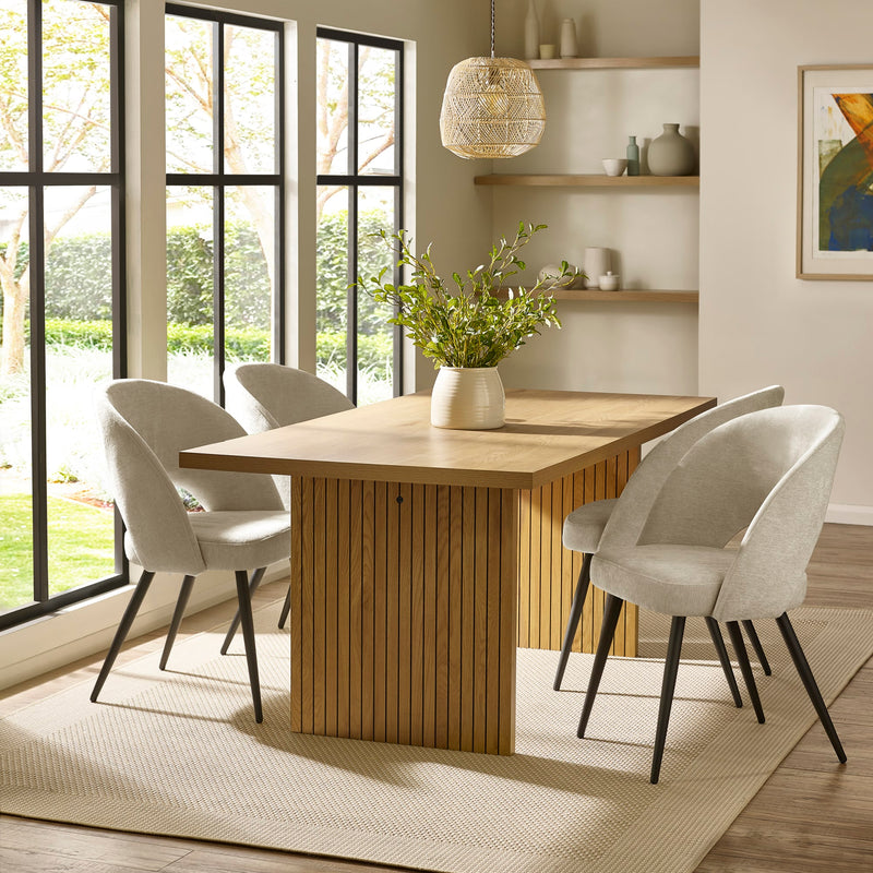 Dining room with wooden table and chairs near large windows