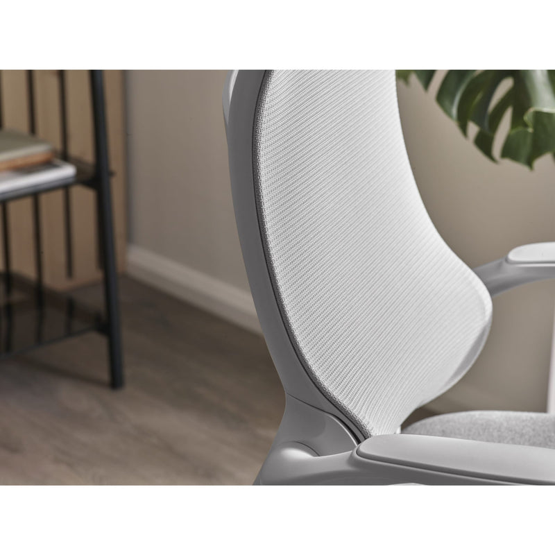 Close-up of a gray office chair with mesh backrest in an indoor setting.