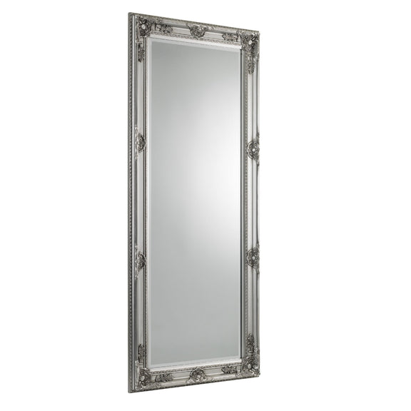 Decorative silver-framed mirror on a white background