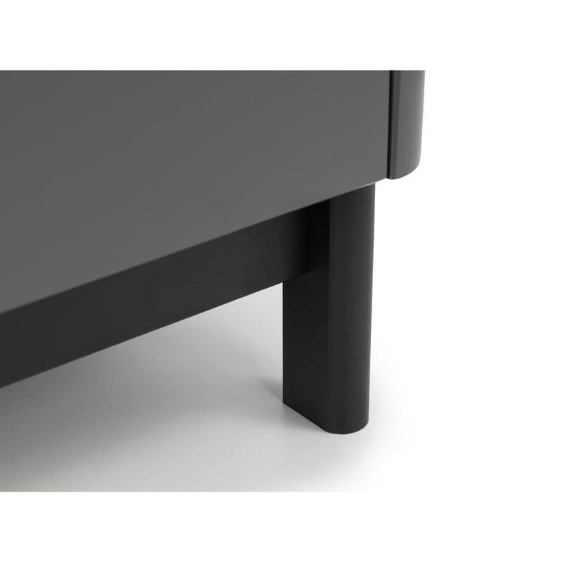 Close-up of a dark gray table with a black leg on a white background