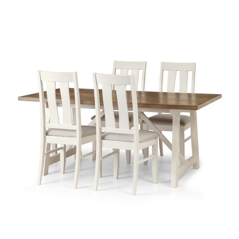 Dining table with four matching chairs on a white background