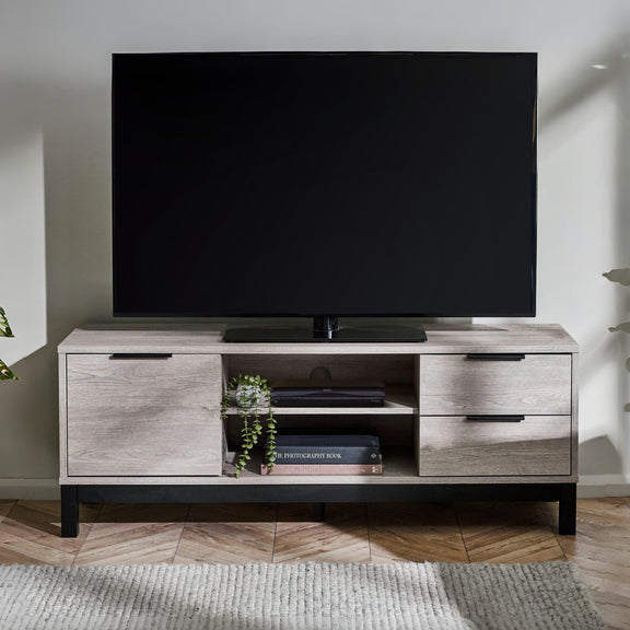 TV on a wooden stand in a living room setting