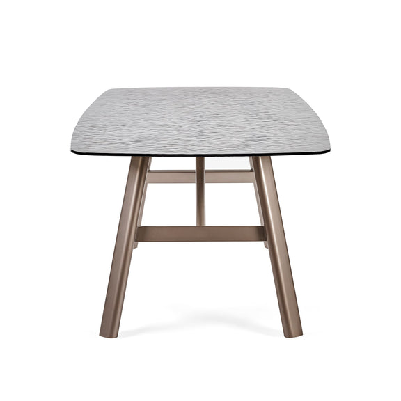 Small table with a textured surface and wooden legs on a white background