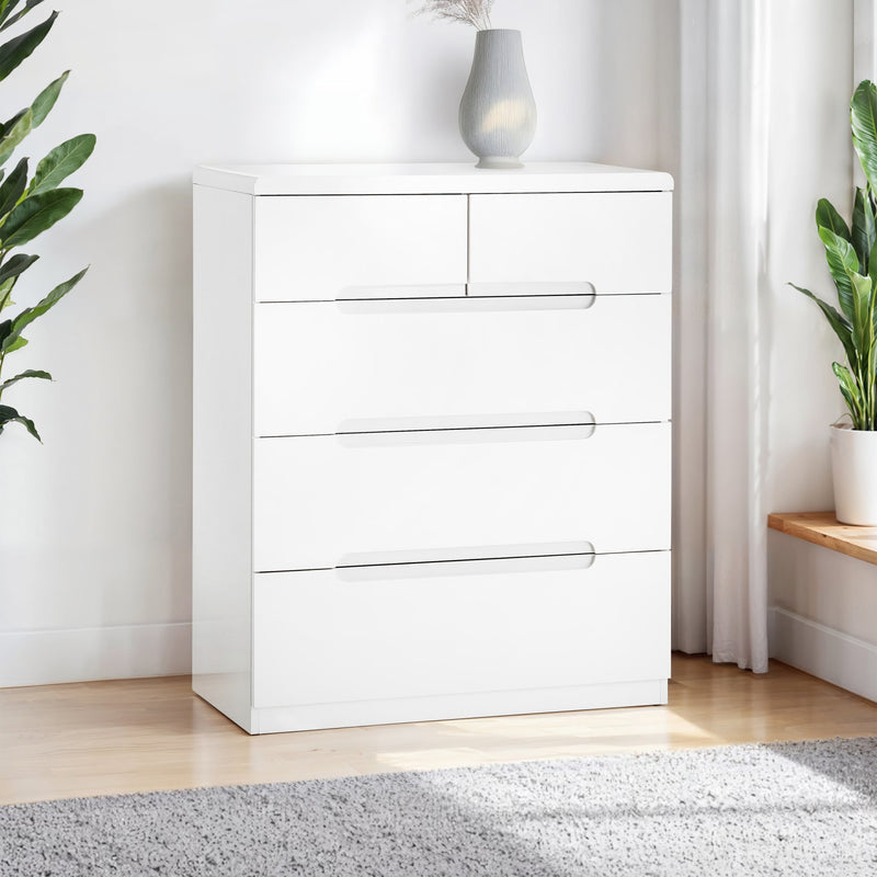White dresser with four drawers in a room with plants and a rug.