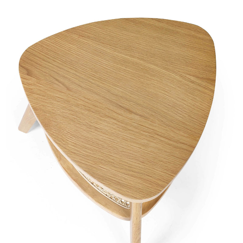 Wooden side table with a unique triangular shape on a white background