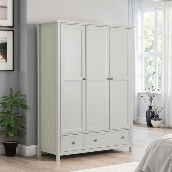 Gray wardrobe in a bedroom with a plant and window in the background