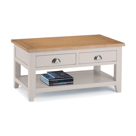 Coffee table with wooden top and beige base on a white background