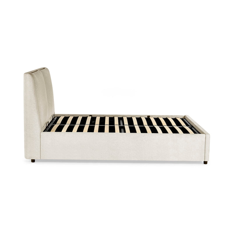 Modern bed with striped mattress on a white background