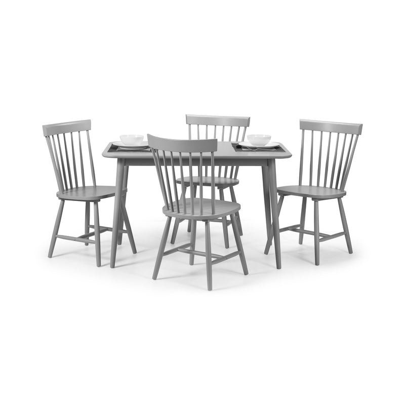 Gray dining table with four matching chairs on a white background