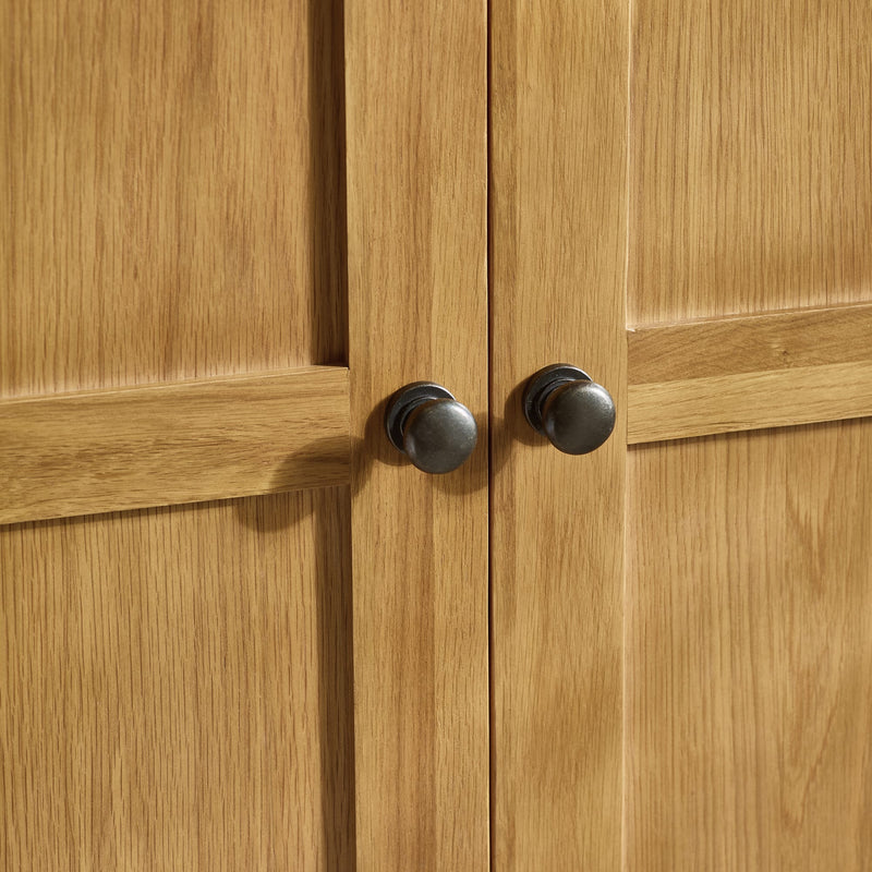 Close-up of wooden cabinet doors with metal handles
