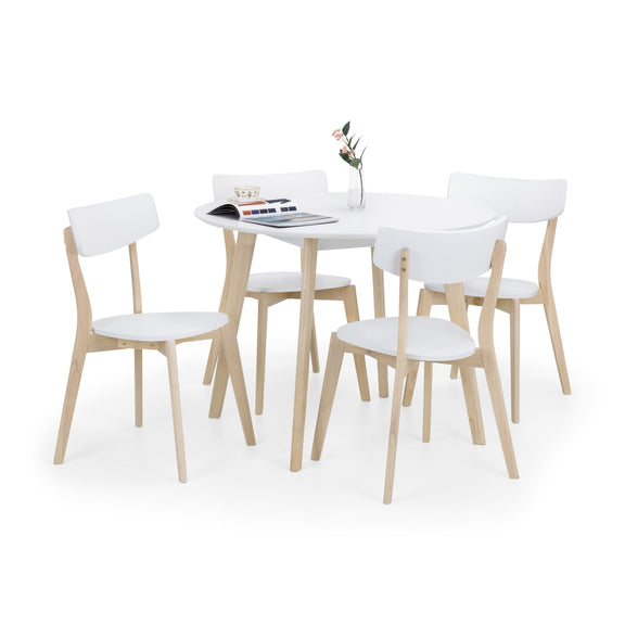 Dining table set with white chairs on a white background