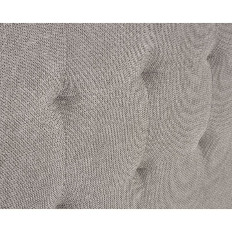 Close-up of a gray textured fabric with tufted design