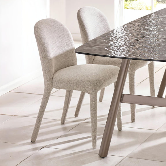 Dining table with two chairs in a bright room
