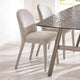 Dining table with two chairs in a bright room
