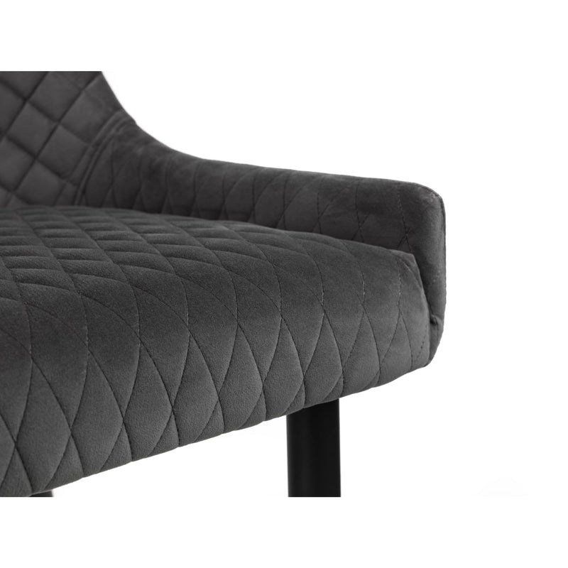 Gray quilted armchair on a white background
