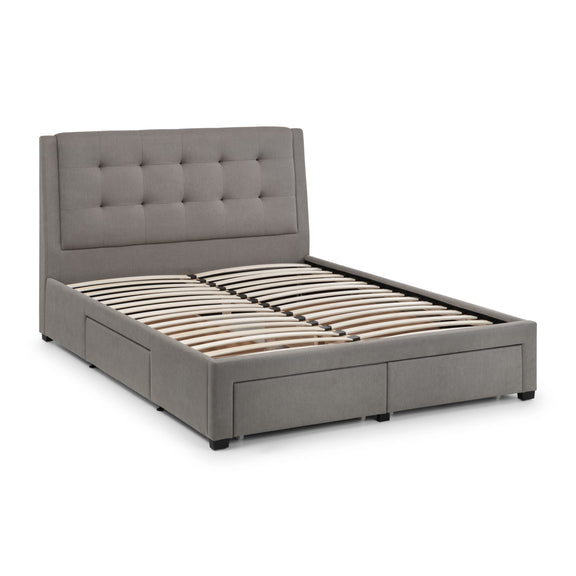 Gray upholstered bed with tufted headboard on a white background