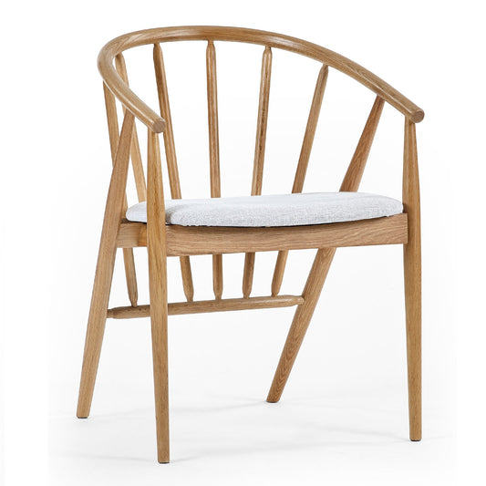 Wooden chair with a white cushion on a white background