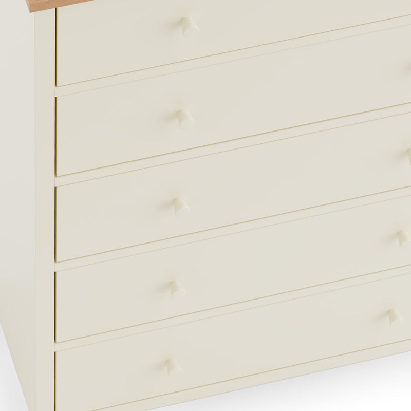 Close-up of a wooden drawer with visible grain and texture on a white background