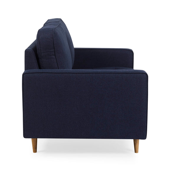 Navy blue sofa with wooden legs on a white background