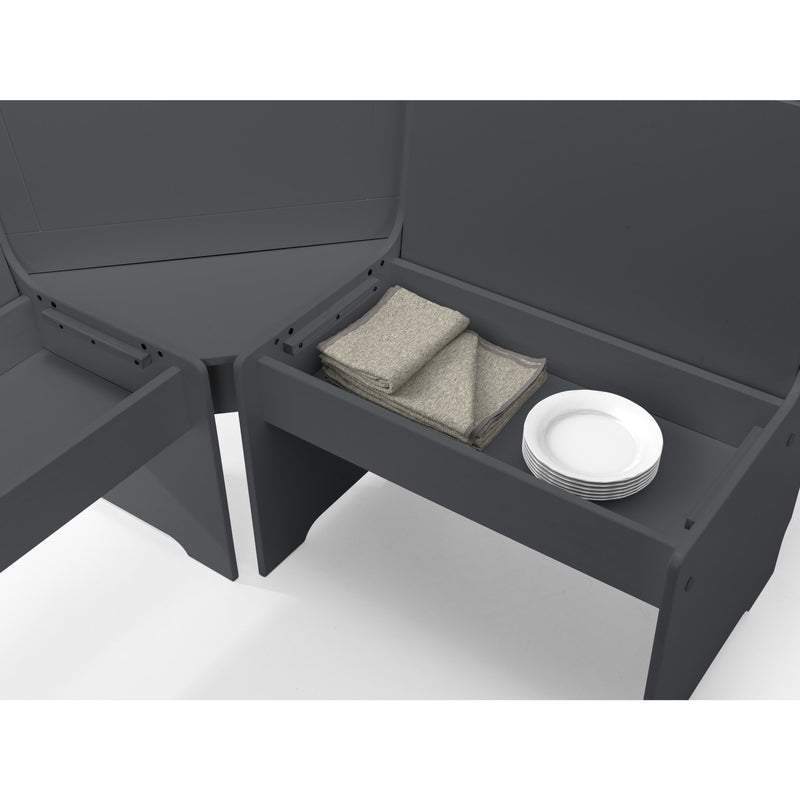 Gray outdoor table with storage compartments and a stack of plates on a white background
