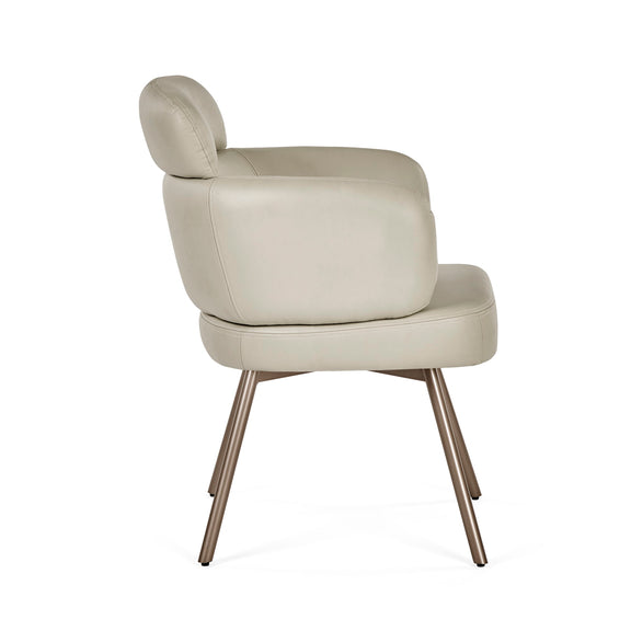 Beige armchair with bronze legs on a white background