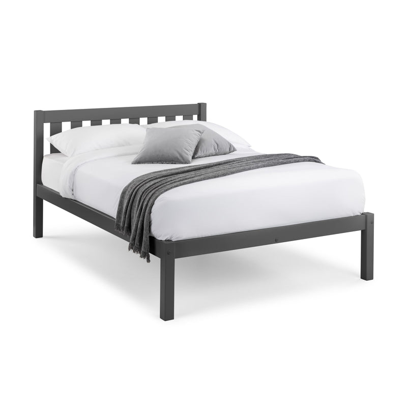 Gray bed frame with white bedding and gray blanket on a white background