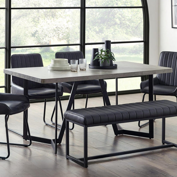 Dining room with a table, chairs, and bench in a modern setting.