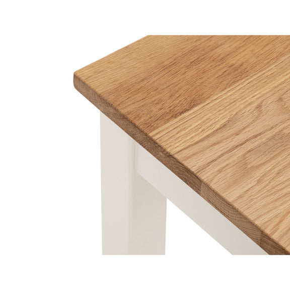 Wooden table top with white legs on a white background