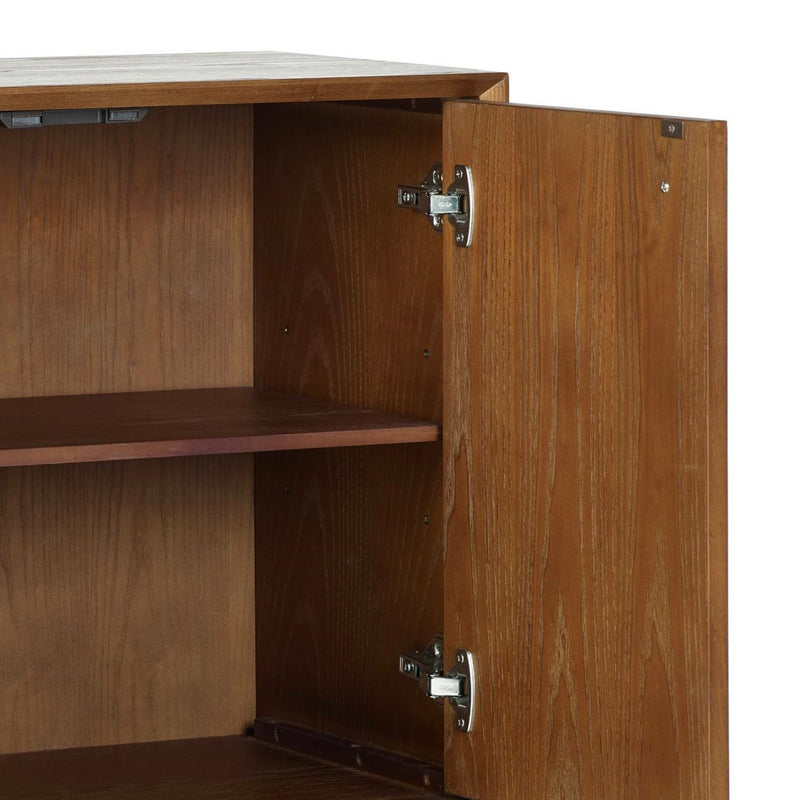 Wooden cabinet with an open door showing a hinge