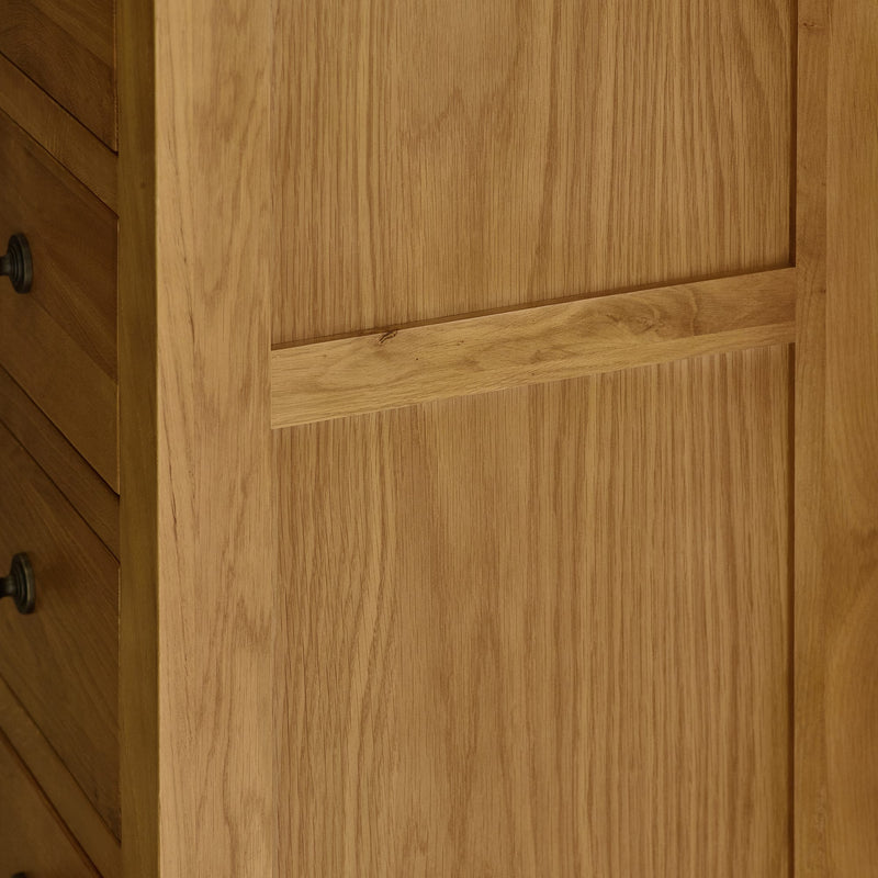 Close-up of a wooden cabinet door with a visible grain pattern.