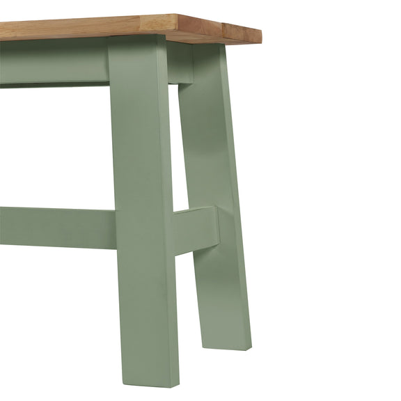 Green wooden table leg on a white background