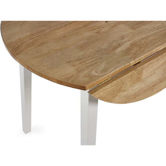Wooden dining table with white legs on a white background