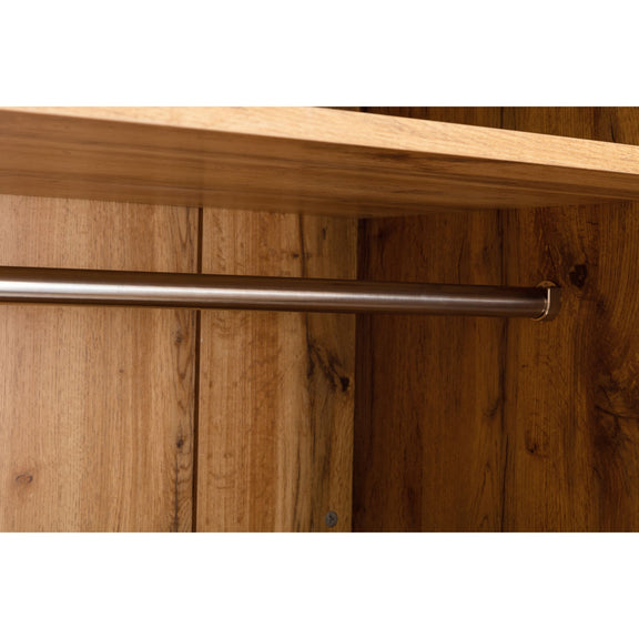 Wooden shelf with a metal rod on a wooden wall