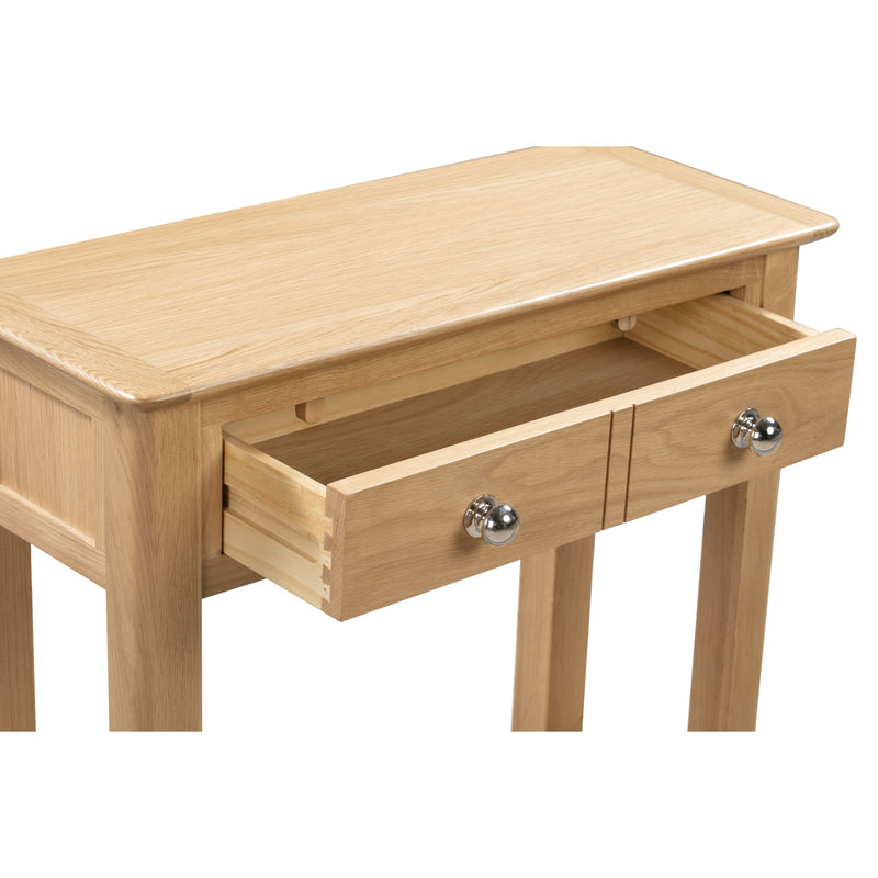 Wooden side table with two drawers on a white background