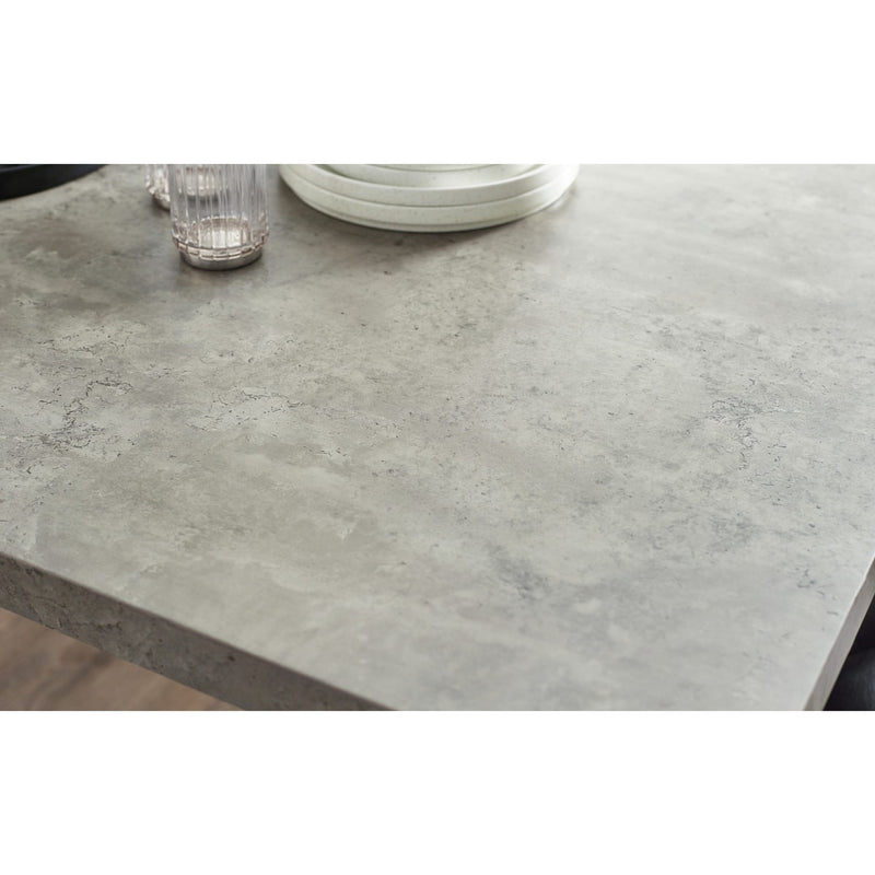 Gray concrete-style countertop with a glass and plates on a white background