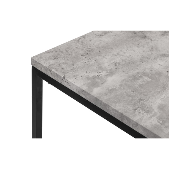 Concrete table top with black metal legs on a white background