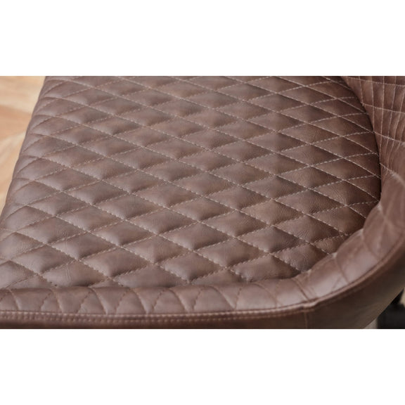 Brown quilted leather seat cover on a vehicle seat