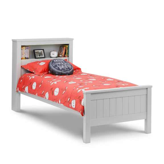 White bed frame with red bedding and decorative items on a white background