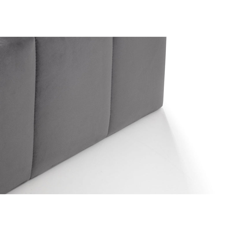 Gray upholstered headboard corner on a white background