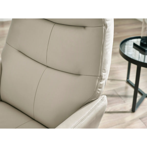 Beige leather chair with a blurred background