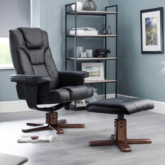 Gray recliner chair with ottoman in a room with a bookshelf and decor.