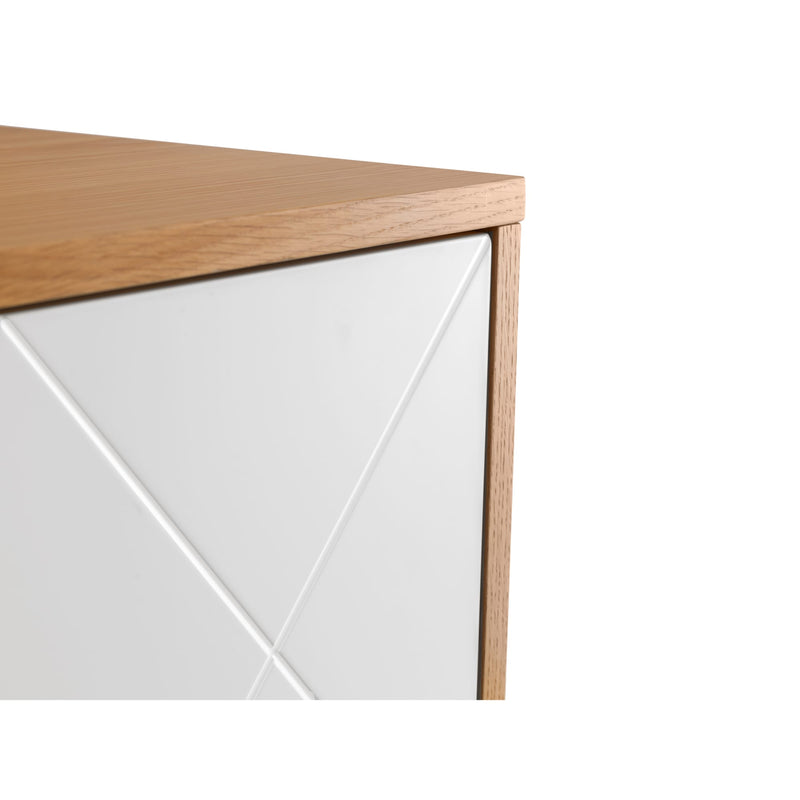 Close-up of a wooden desk corner with white paneling