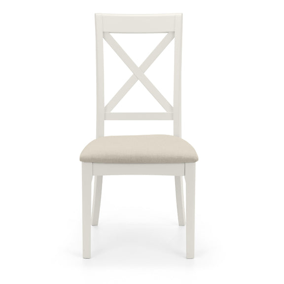 White chair with a beige cushion on a white background