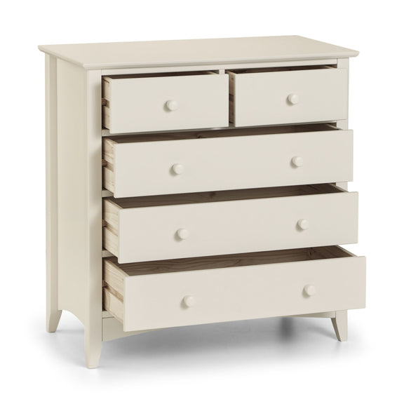 White dresser with multiple drawers on a white background