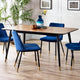 Dining room with a wooden table and blue chairs on a wooden floor.