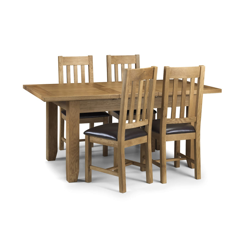 Wooden dining table with four matching chairs on a white background