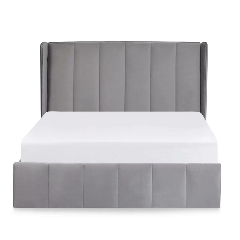 Gray upholstered bed frame with a white mattress on a white background