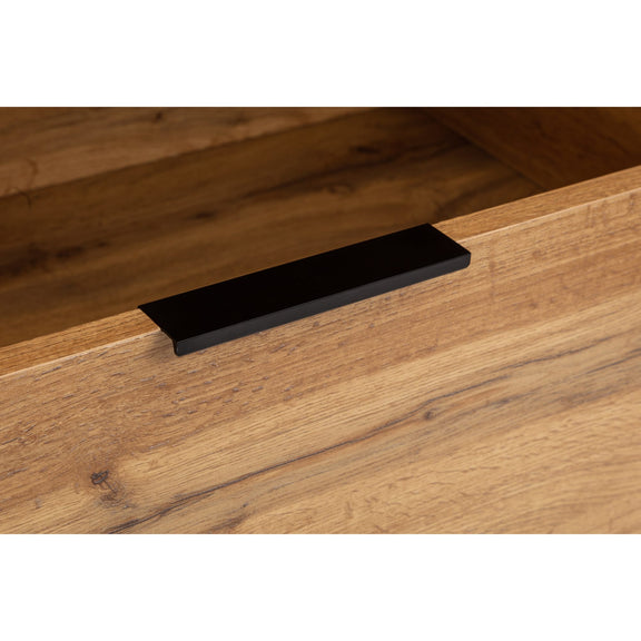Wooden drawer with a black handle on a wooden surface