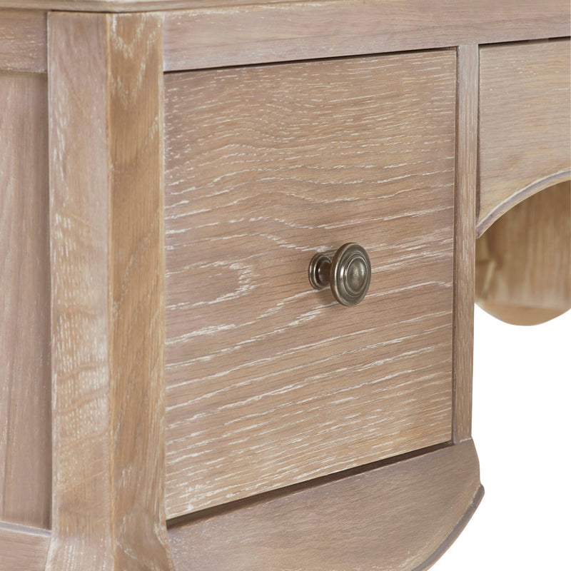 Close-up of a wooden drawer with a knob on a piece of furniture.